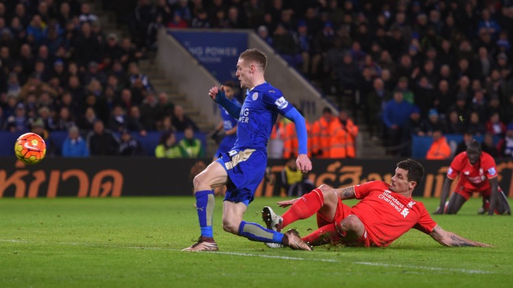 Michael Regan  Getty Images Jamie Vardy scores his second goal to take his season's tally to 18 and keep Leicester top