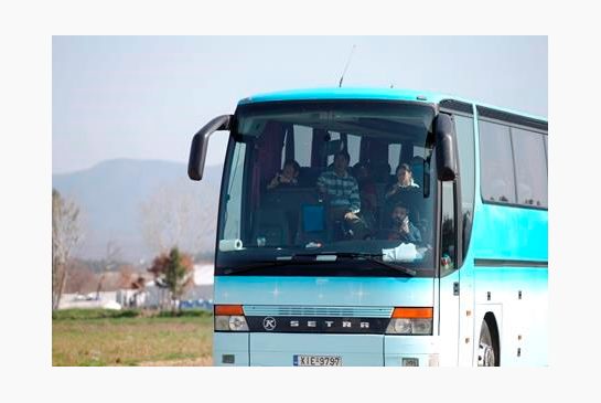 Afghan migrants sit inside a bus as they leave from the northern Greek border station of Idomeni on Tuesday Feb. 23 2016. In an early morning operation police at the Greek Macedonian border ordered mostly Afghan migrants onto buses bound for Athens. T