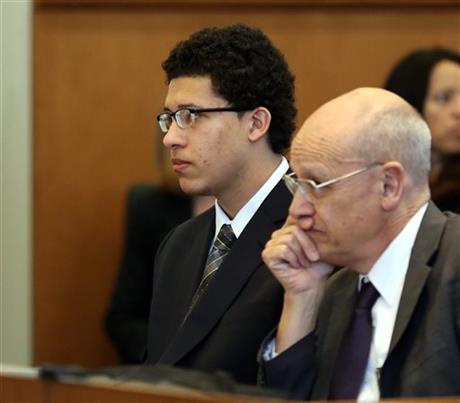 Philip Chism sits in silence while waiting for Judge David Lowy to enter the courtroom during his sentencing in Salem Superior Court Salem Mass. Friday Feb. 26 2016. Chism was accused of first-degree murder along with rape and robbery in the Oct. 2