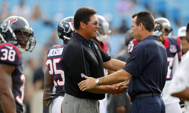 Carolina Panthers head coach Ron Rivera front left and then Houston Texans head coach Gary Kubiak now coach of the Denver Broncos speak before an NFL preseason football game in Charlotte N.C. Even the guys