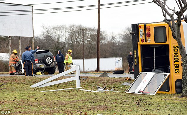 The scene Emergency personnel respond to the scene of an accident involving a school bus and SUV in Fairfield Township N.J. on Thursday that left one dead and a number of children injured