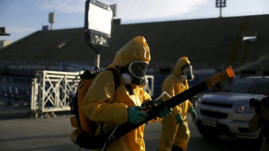 Municipal workers spray insecticide at Sambodrome in Rio de Janeiro