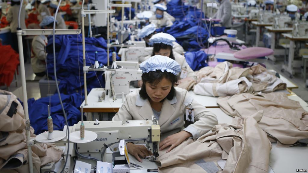 FILE- North Korean employees shown in December 2013 sew in a South Korean-owned company at the Kaesong industrial park just north of the demilitarized zone