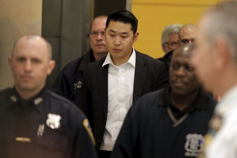 New York City Police officer Peter Liang is led from the court room at the Brooklyn Supreme court after being convicted of manslaughter and official misconduct. – Reuters pic