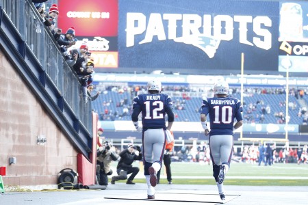 Jan 16 2016 Foxborough MA USA New England Patriots quarterback Tom Brady and quarterback Jimmy Garoppolo run onto the field prior to the AFC Divisional round playoff game against the Kansas City Chiefs at Gillette Stadium. Mandatory Credit