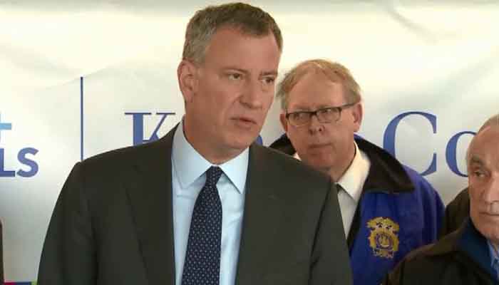 New York City Mayor Bill de Blasio speaks about two officers being wounded early Saturday morning