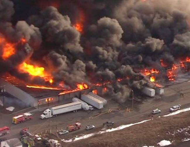 Firefighters are battling a large warehouse fire in an industrial park along U.S. 206 in Hillsborough on Thursday Feb.11 2016