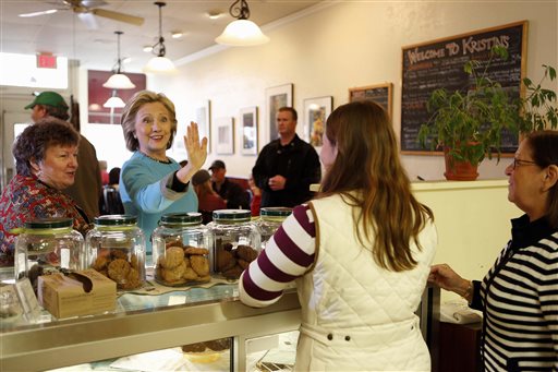 Democratic presidential candidate Hillary Clinton waves to employees at Kristin's Bakery during her first New Hampshire campaign stop in Keene N.H. AP