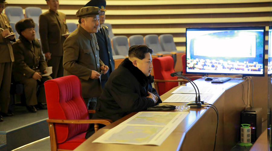 North Korean leader Kim Jong Un reacts as he watches a long range rocket launch in this undated