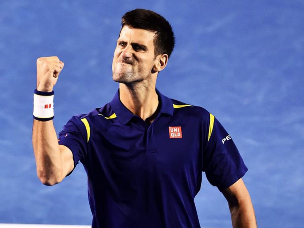 Novak Djokovic celebrates during his four-set win over Roger Federer EPA