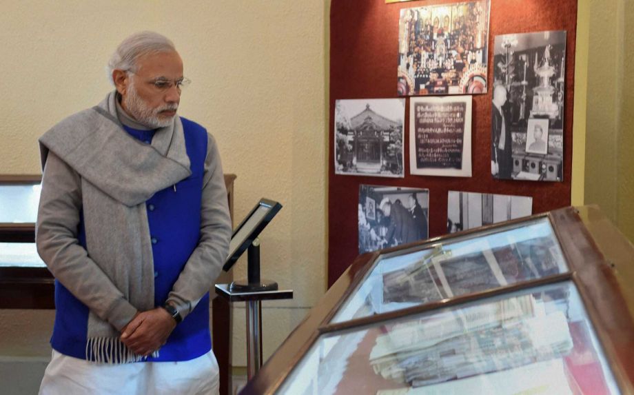 Indian Prime Minister Narendra Modi looks at documents displayed at the National Archives of India where he released the digital copies of 100 declassified files related to Netaji Subhash Chandra Bose in New Delhi India Saturday Jan. 23 2016. In