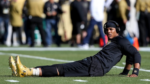 Cam Newton's golden cleats also showed off a number of statistics such as his total yardage for the season completion rate and first downs