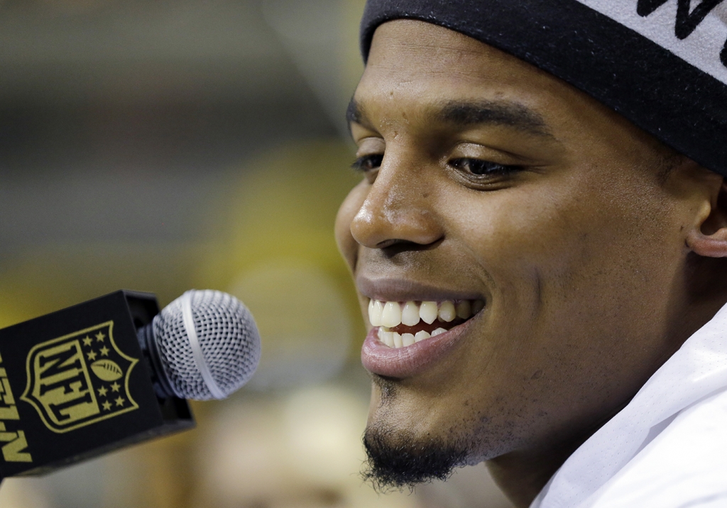 Carolina Panthers&#039 Cam Newton answers a question during Opening Night for the NFL Super Bowl 50 football game Monday Feb. 1 2016 in San Jose Calif