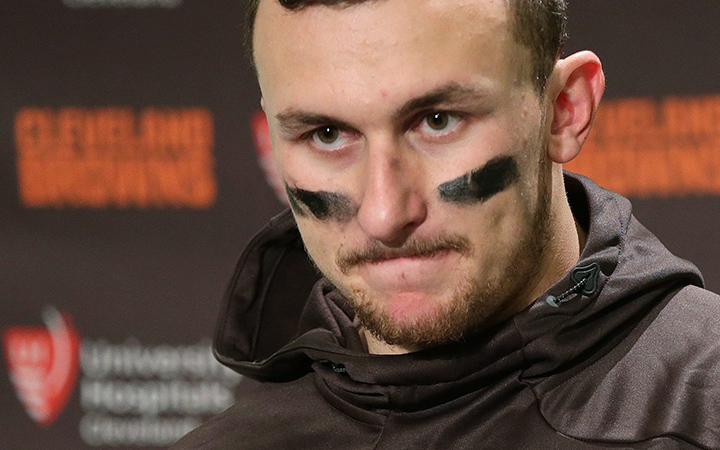 Cleveland Browns quarterback Johnny Manziel speaks with media members after an NFL football game against the Seattle Seahawks Sunday Dec. 20 2015 in Seattle