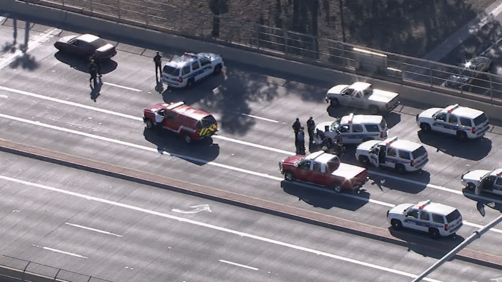 Police vehicles crowd the scene of an officer-involved shooting at 75th Avenue and I-10 Feb. 24 2016