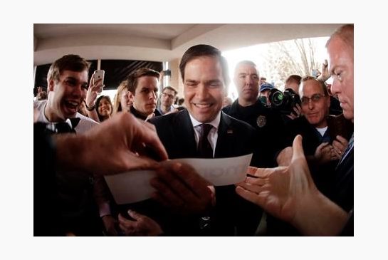 Republican presidential candidate Sen. Marco Rubio R-Fla autographs a bumper sticker after speaking at a rally Sunday Feb. 21 2016 in Franklin Tenn