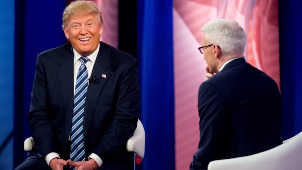 Republican presidential candidate Donald Trump laughs as he speaks with Anderson Cooper at a CNN town hall at the University of South Carolina in Columbia S.C. on Thursday