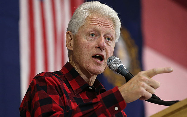 President Bill Clinton campaigns for his wife Democratic presidential candidate Hillary Clinton during a campaign event at Milford Junior High School