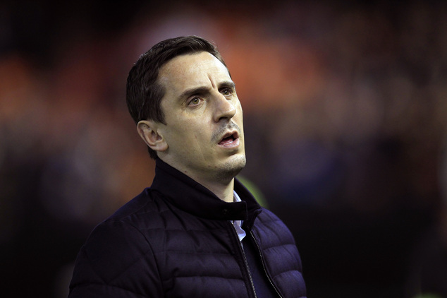 Valencia's head coach Gary Neville arrives for a Spanish La Liga soccer match against Real Madrid at the Mest