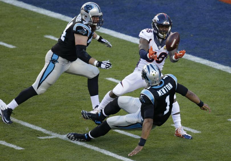 Denver Broncos’ Von Miller strips the ball from Carolina Panthers’ Cam Newton during the first half of the NFL Super Bowl 50 football game Sunday in Santa Clara Calif. The Broncos recovered the ball for a touchdown. Miller was named MVP of