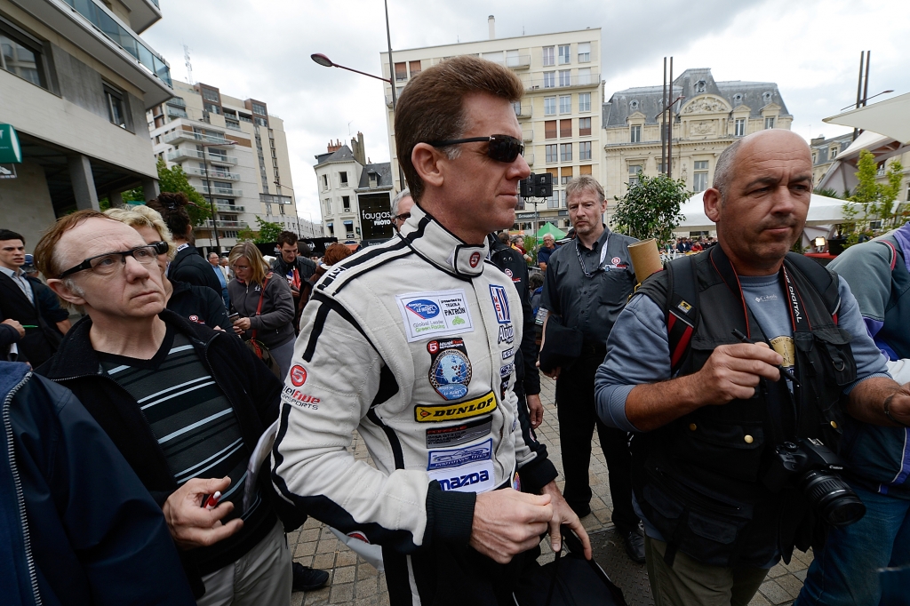 Scott Tucker of the United States and driver of the #33 Level 5 Motorsports HPD Honda during scrutineering for the 80th running of the Le Mans 24 Hour race at Place de La Republique