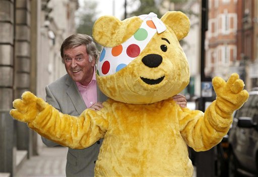 Terry Wogan poses with Pudsey Bear the mascot of the charity Children in Need in London. Wogan one of the best-known voices and faces on British television and radio has died aged 77. His family said in a stateme