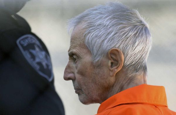 Robert Durst is escorted into Orleans Parish Prison