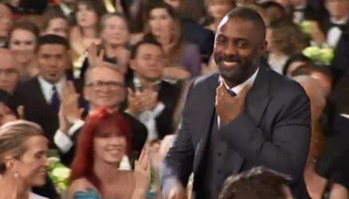 Actor Idris Elba walks through the crowd to accept his second award of the night at the Screen Actors Guild Awards Saturday night