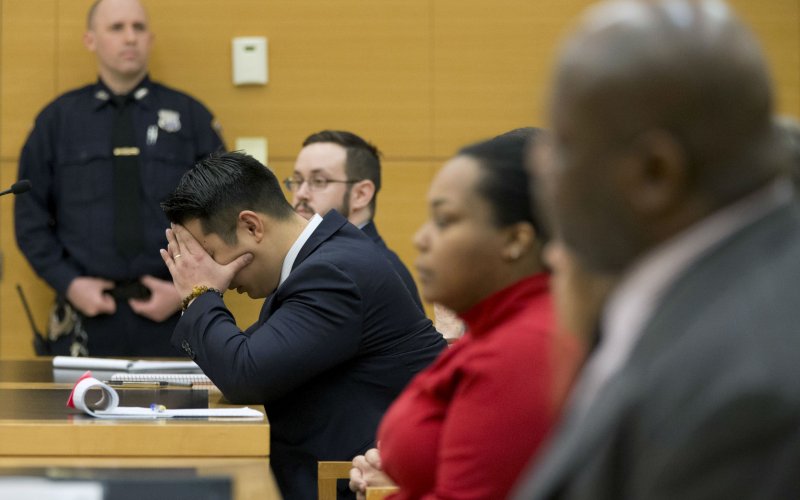 New York City Police officer Peter Liang reacts as the verdict is read during his trial in court room at the Brooklyn Supreme court in the Brooklyn borough of New York