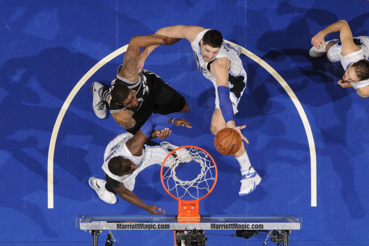 Nikola Vucevic right going up for a rebound has 20 points and 13 rebounds for the Magic which lets a 14-point fourth-quarter lead slip away against the Spurs in a 98-96 loss