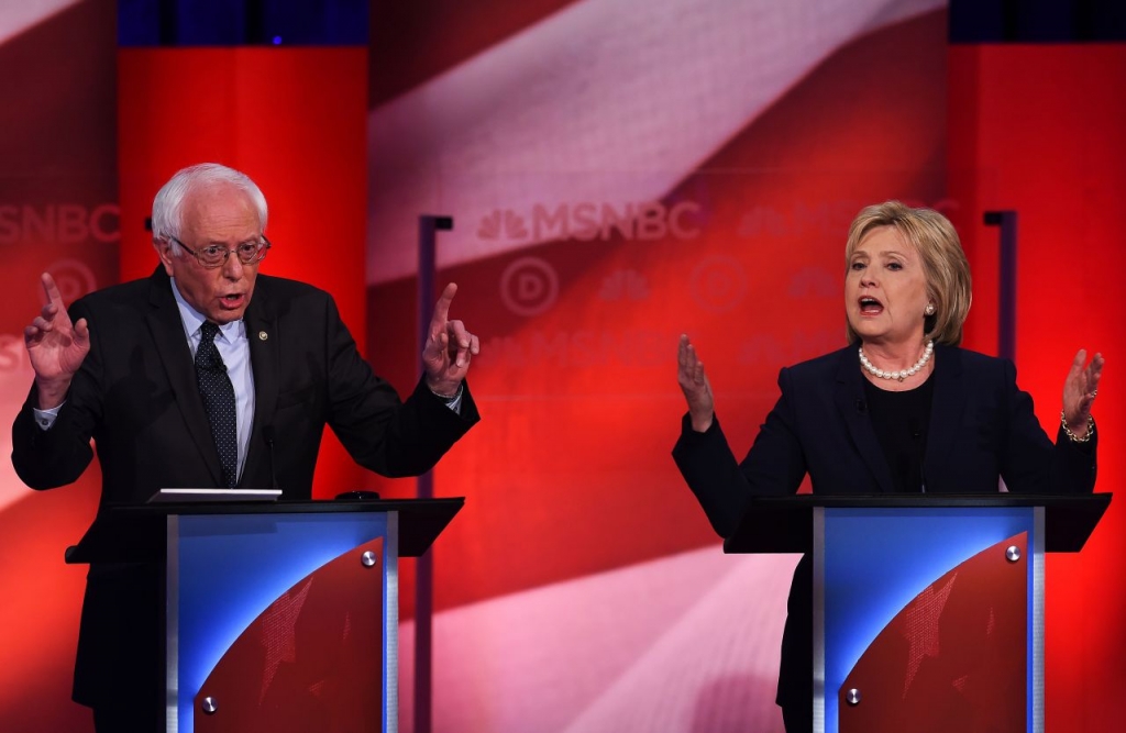 U.S. Democratic presidential candidates Bernie Sanders and Hillary Clinton participate in the MSNBC Democratic Candidates Debate at the University of New Hampshire in Durham