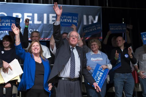 Democratic presidential candidate Sen. Bernie Sanders I-Vt. and his wife Jane Sanders wave to the crowd during a campaign rally at the Burlington Memorial Center on Thursday Jan. 28 2016 in Burlington Iowa