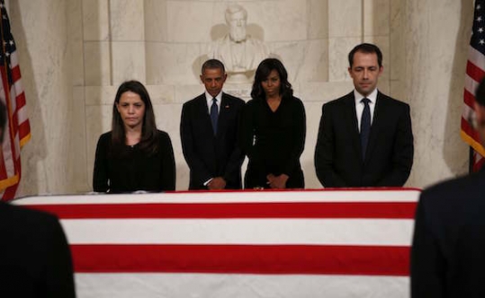 U.S. President Barack Obama and first lady Michelle Obama visit the casket of late U.S. Supreme Court Justice Antonin Scalia in the Supreme Court's Great Hall in Washingt