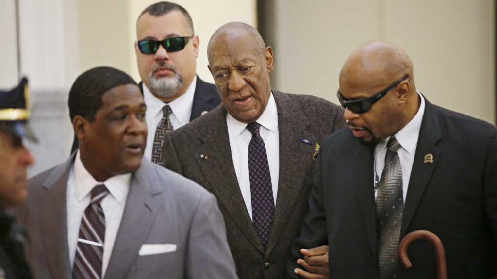 Bill Cosby arrives for a court appearance Wednesday in Norristown Pa. The judge has ruled that the case against him will proceed despite a claim that he was promised immunity a decade ago. Ed Hille  AP