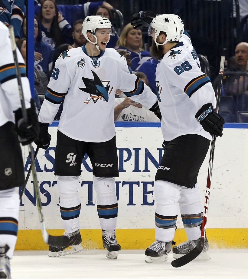 Melker Karlsson celebrates his goal late in the third period with Brent Burns. The goal was Karlsson’s seventh