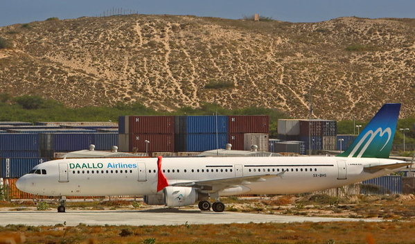 An aircraft belonging to Daallo Airlines is parked at the Aden Abdulle international airport after making an emergency landing following a bomb explosion inside the plane in Somalia´s capital Mogadishu