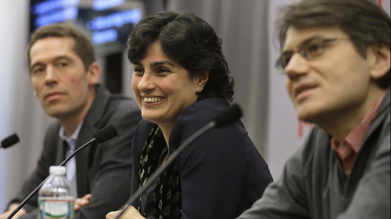 Massachusetts Institute of Technology astrophysics professor Nergis Mavalvala center takes questions from members of the media as MIT physics professor Matthew Evans left and MIT research scientist Erik Katsavounidis right look on during a presentat