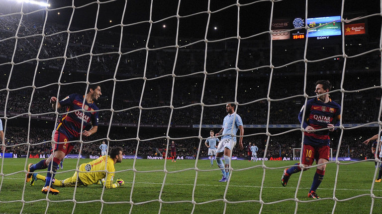 Suarez celebrates his hat-trick goal against Celta Vigo with Messi