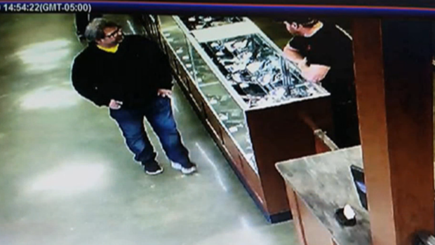 Surveillance footage shows Jason Dalton inside a gun shop hours before going on a shooting spree.         
                                     CBS affiliate W