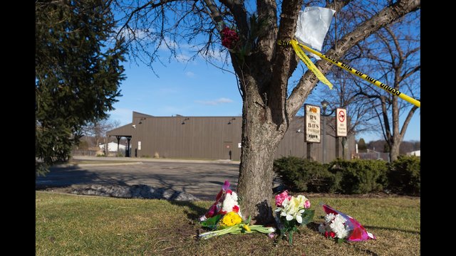 Flowers lie near a makes shift memorial outside a Cracker Barrel Sunday Feb. 21 2016 in Kalamazoo Mich