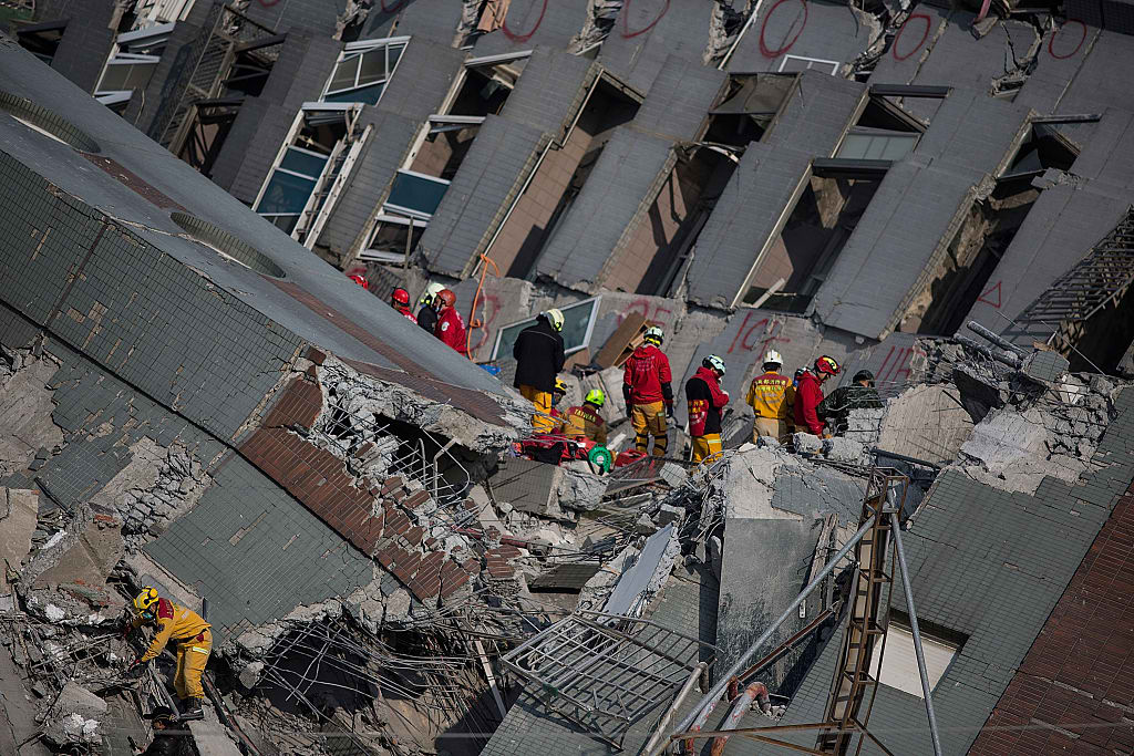 Taiwanese rescuers continue to find signs of life beneath the rubble