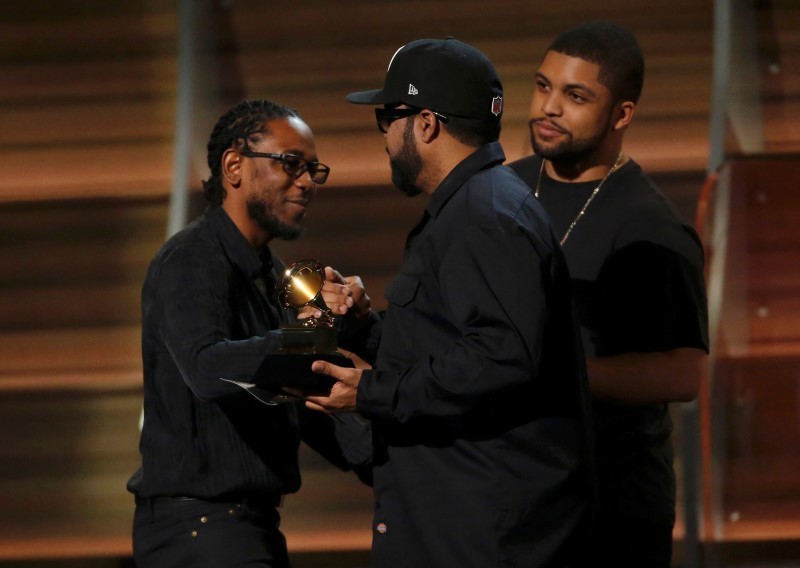 Kendrick Lamar takes the stage to accept the award for Best Rap Album for'To Pimp A Butterfly from presenters Ice Cube and O'Shea Jackson Jr. at the 58th Grammy Awards in Los Angeles California