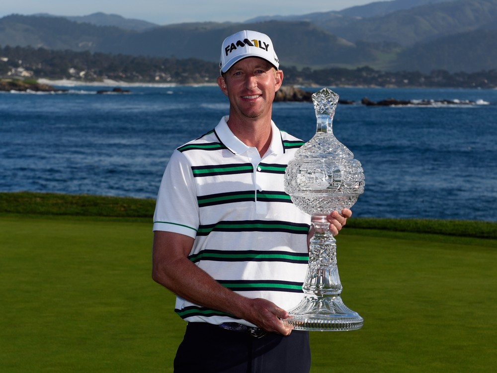 Vaughn Taylor poses with the trophy after winning the AT&T Pebble Beach National Pro Am at the Pebble Beach Golf Links