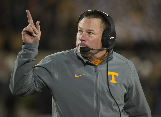 Tennessee head coach Butch Jones points to the scoreboard during the first quarter of an NCAA college football game against Missouri in Columbia Mo. Tennessee head coaches will hold a rare joint press conference T