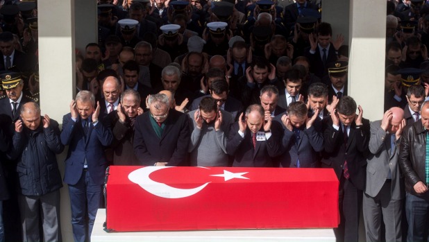 People pray at a funeral for eight victims of the February 17 car bombing at the Kocatepe Mosque in Ankara Turkey. At least 28 people were killed and 61 people injured when a car bomb exploded beside a convoy of military vehicles