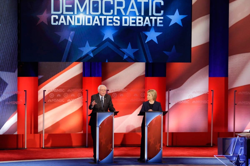 Democratic presidential candidate Sen. Bernie Sanders I-Vt makes his opening statement as Democratic presidential candidate Hillary Clinton listens during a Democratic presidential primary debate hosted by MSNBC at the University of New Hampshire Thur