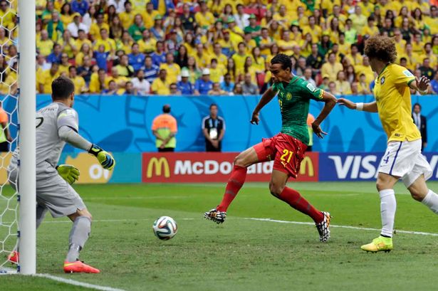 Cameroon's Joel Matip scores his side's first goal during the Group A World Cup match between Cameroon and Brazil