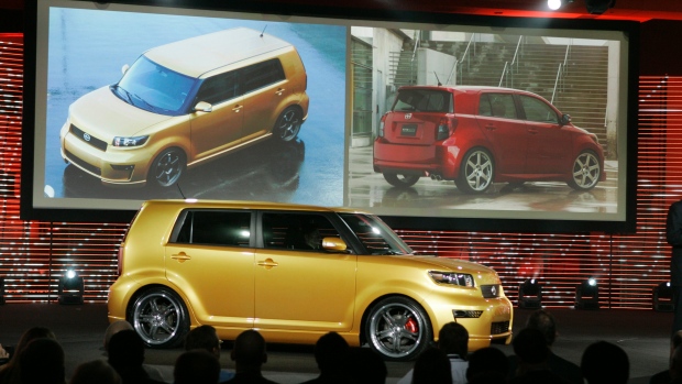 The Scion xB foreground was one of the funky youth-oriented Scion models Toyota launched over the years