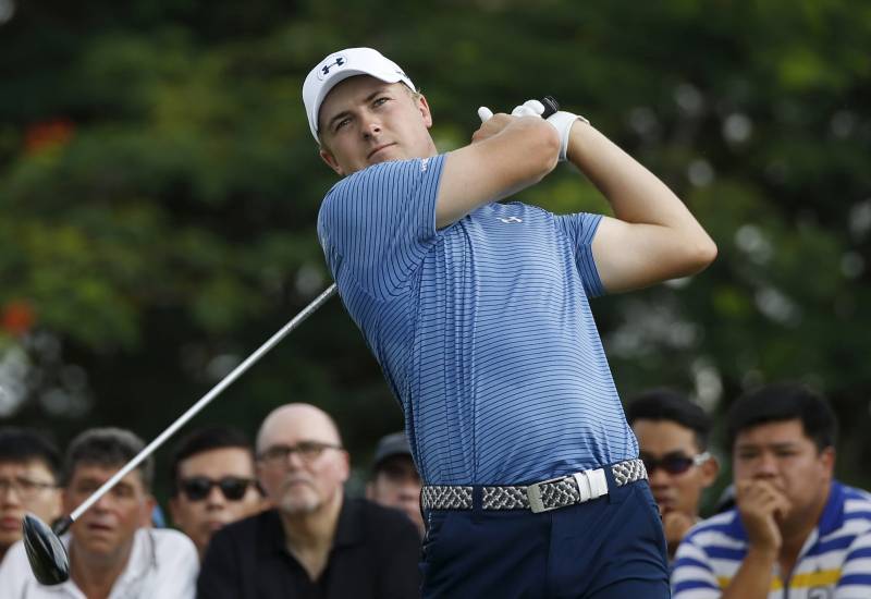 Jordan Spieth of the U.S. tees off on the ninth hole during the first round of the SMBC Singapore Open golf tournament at Sentosa's Serapong golf course in Singapore