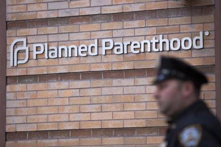 A member of the New York Police Department stands outside a Planned Parenthood clinic in the Manhattan borough of New York